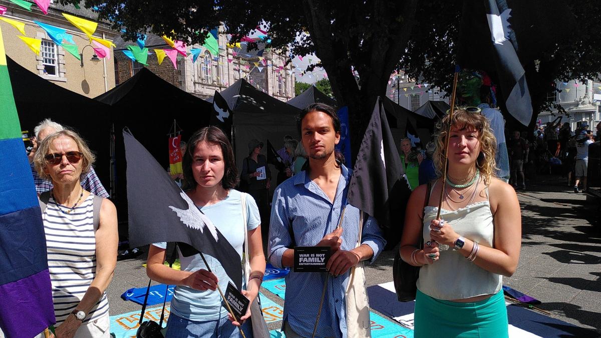 Four people forming part of a peace protest in Falmouth