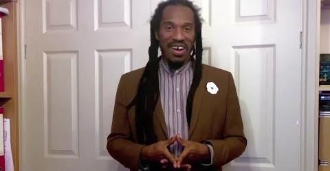 Benjamin Zephaniah wearing a white poppy