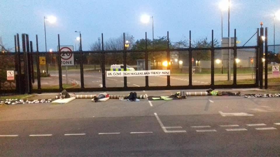 Nonviolent activists blocking main entrance at Burghfield AWE