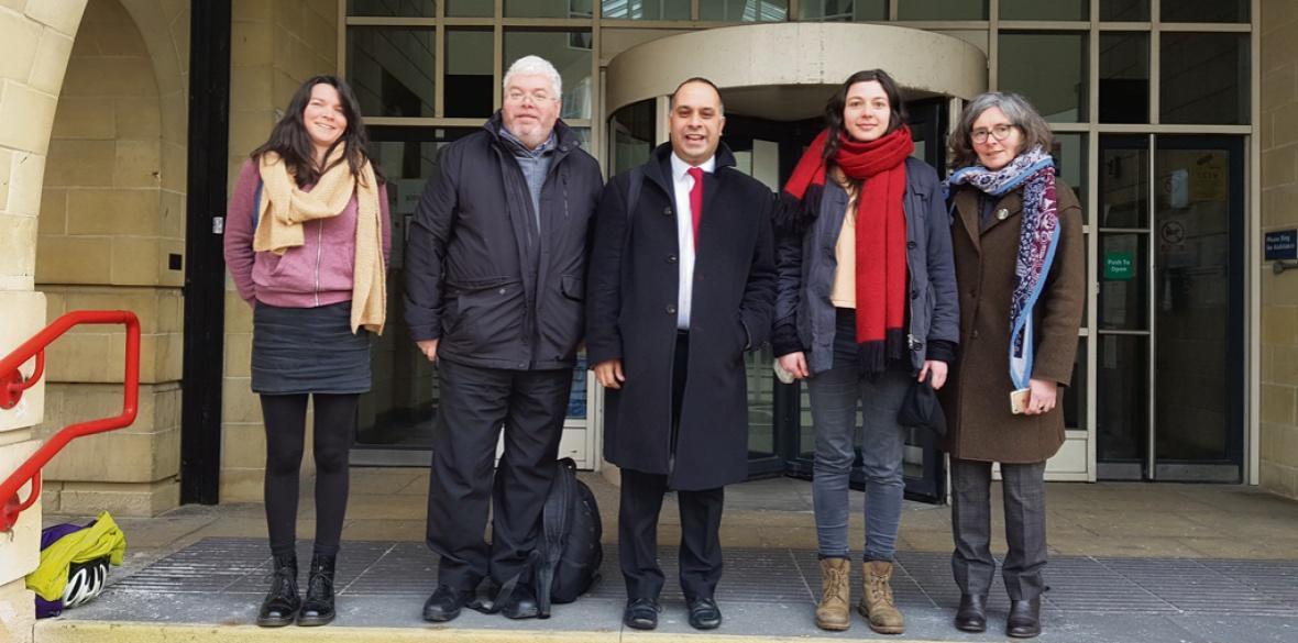 The four defendants and their solicitor outside court at an earlier hearing.