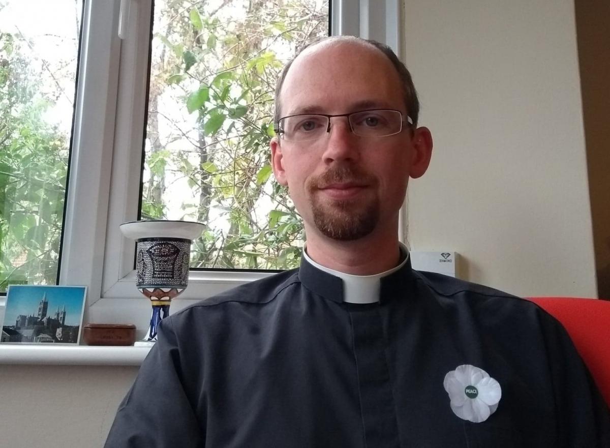 Rev Matthew Harbage wearing a white poppy